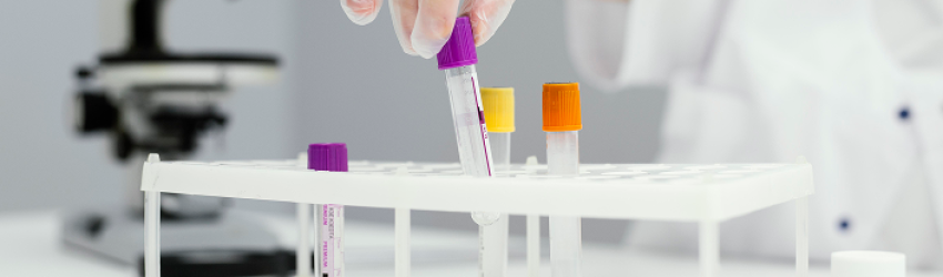 girl-scientist-with-test-tubes-lab-coat